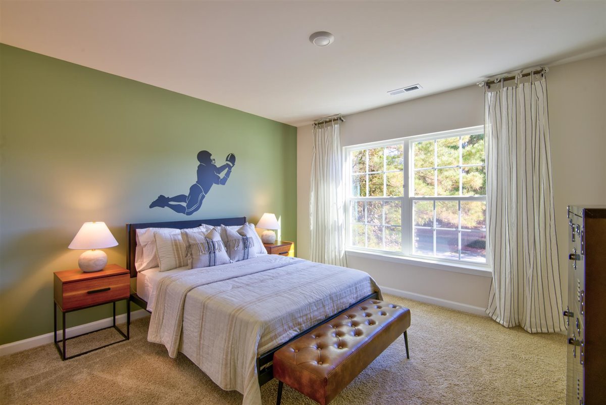 bedroom with carpet and natural light