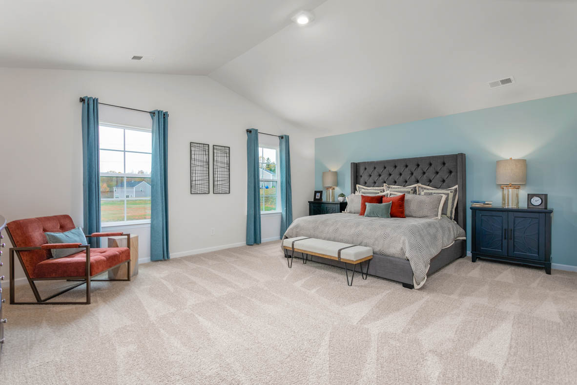 bedroom with carpet and natural light
