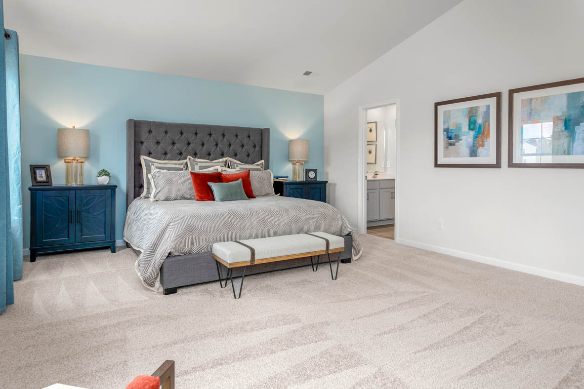 bedroom with carpet and natural light