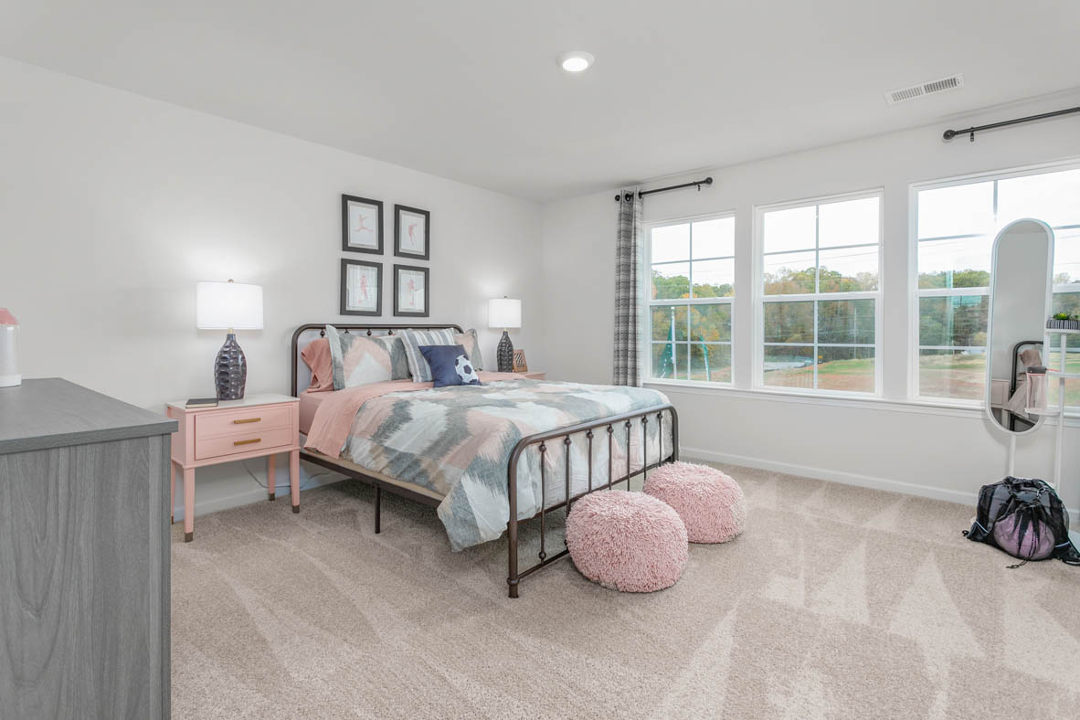 bedroom with carpet and natural light