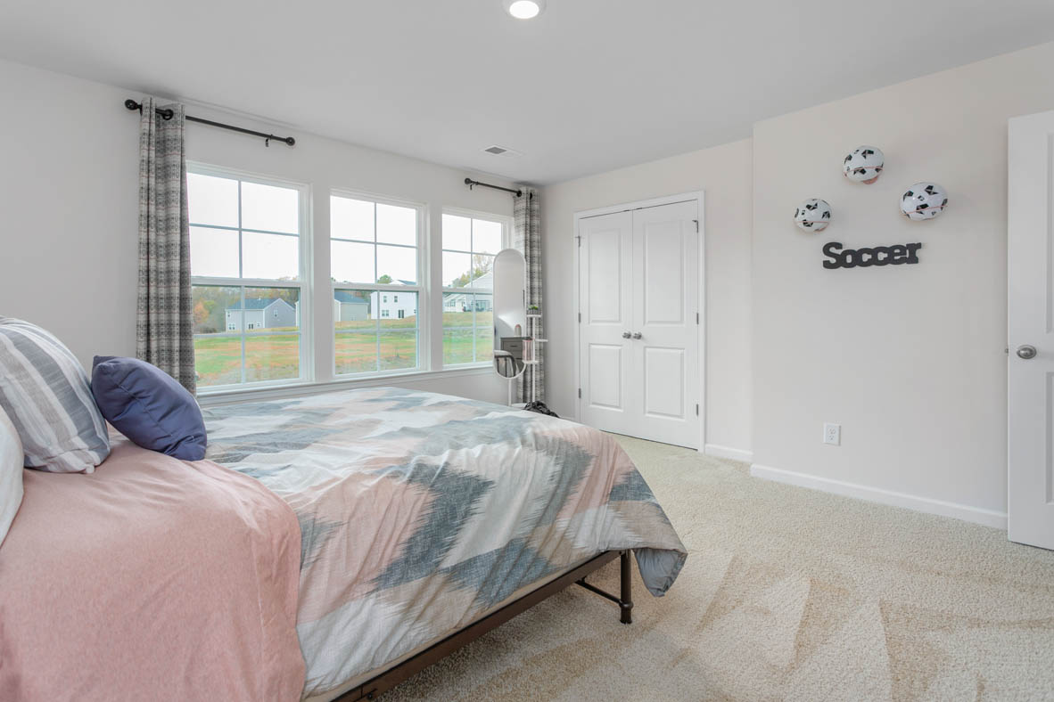 bedroom with carpet and natural light