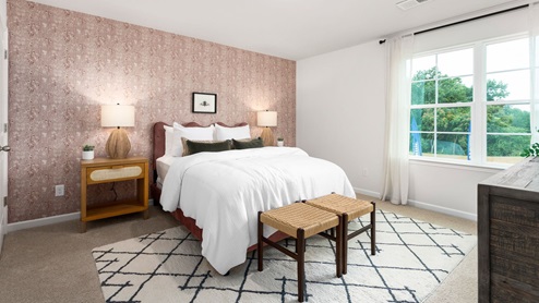 bedroom with carpet and ample light