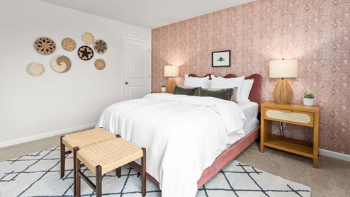 bedroom with carpet and ample light