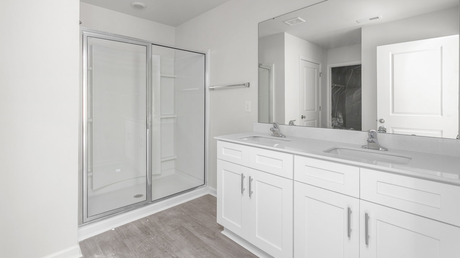 primary bathroom with dual sinks
