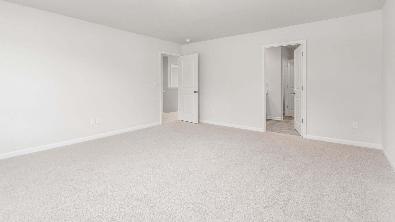 Primary bedroom with carpet