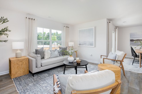 living room with vinyl floors and natural light