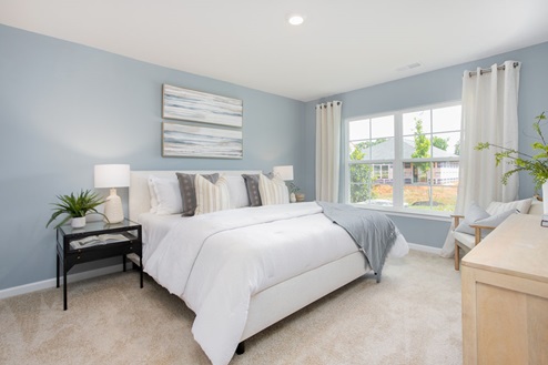 bedroom with carpet and natural light