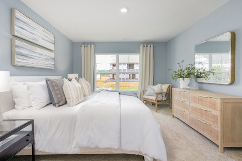 bedroom with carpet and natural light