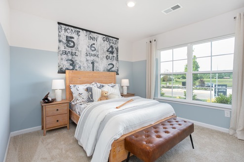 bedroom with carpet and natural light
