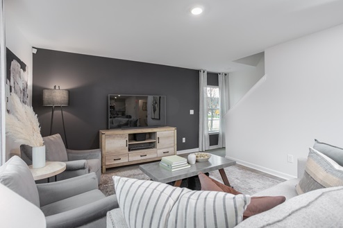 living room with vinyl floors and natural light