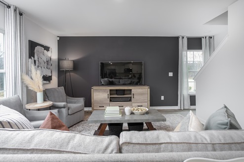 living room with vinyl floors and natural light