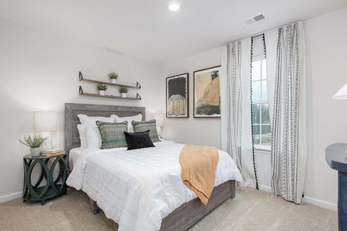 bedroom with carpet and natural light