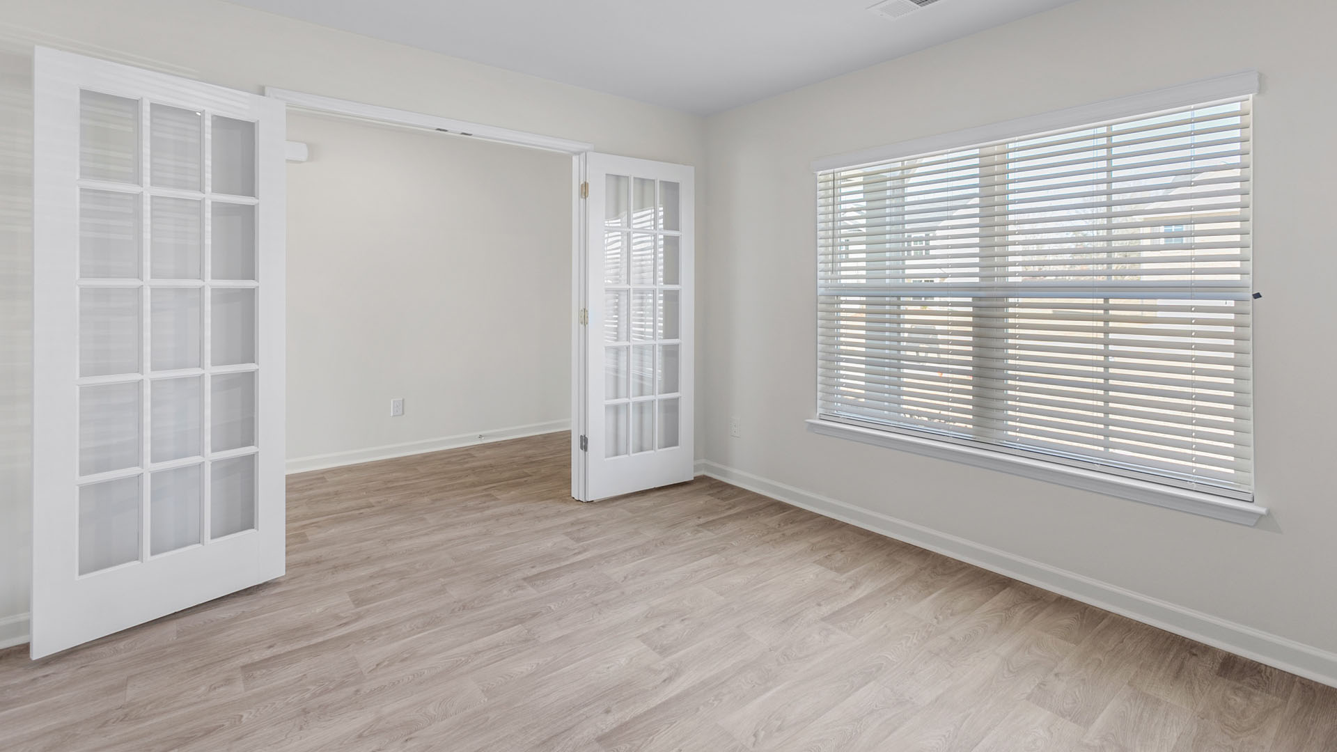 Foyer with vinal floor and French doors