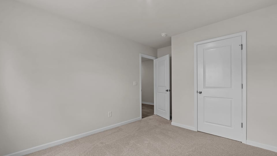 secondary bedroom with carpet