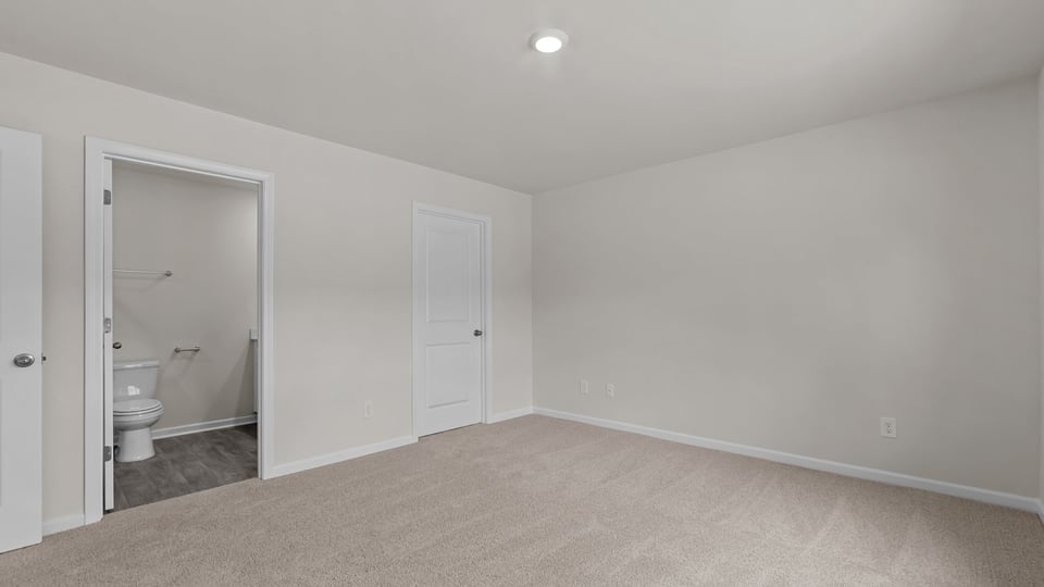 primary bedroom with carpet