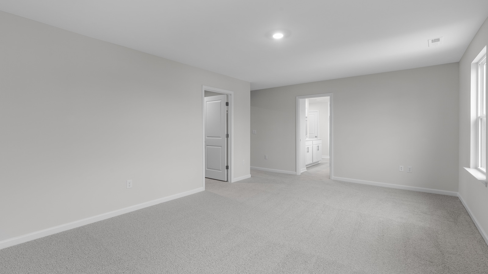 primary bedroom with carpet