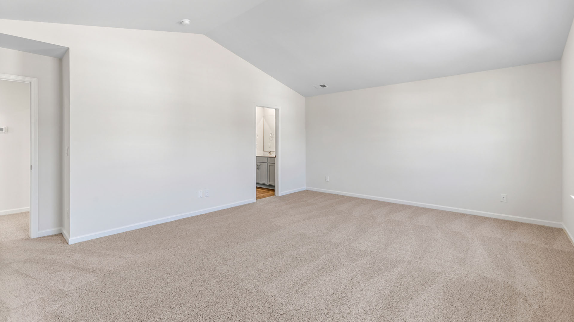 primary bedroom with carpet