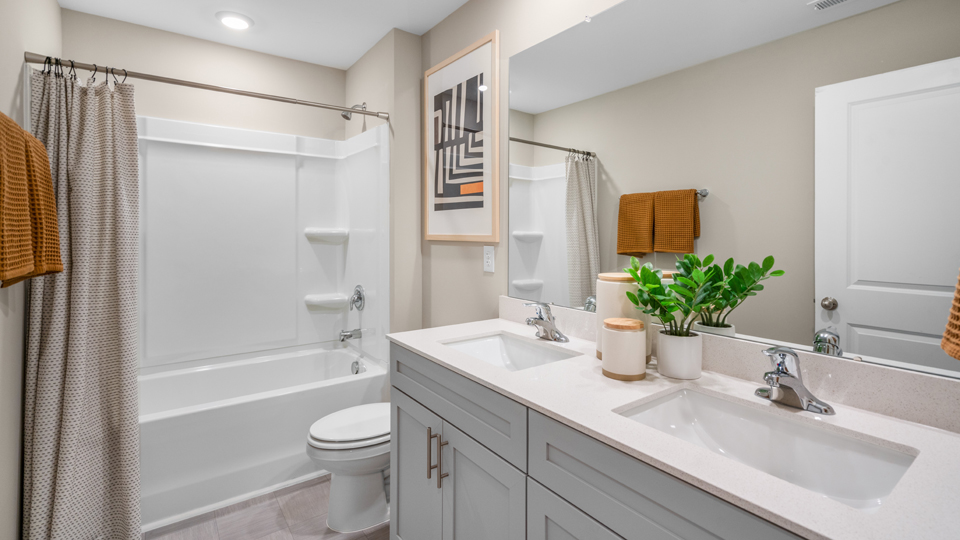 secondary bathroom with tub shower combo