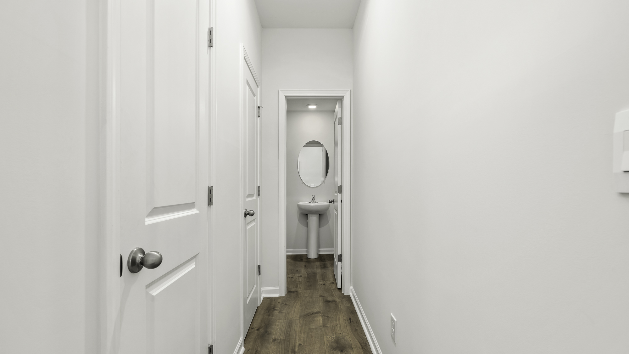 hallway and half bathroom view
