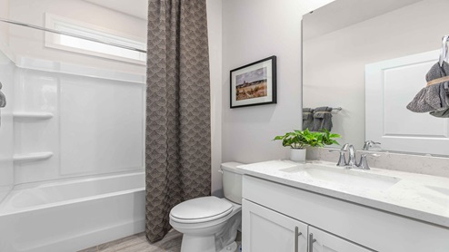 bathroom with tub shower combo
