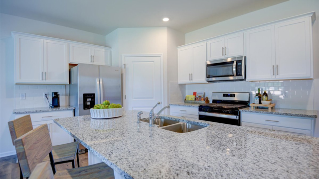 Kitchen with revwood floors and island