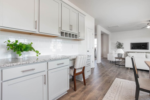 kitchen with revwood floors an island and stainless steel appliances