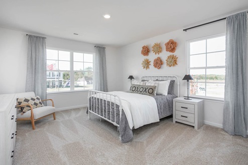 bedroom with carpet and natural light