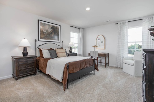 bedroom with carpet and natural light