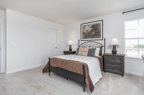 bedroom with carpet and natural light