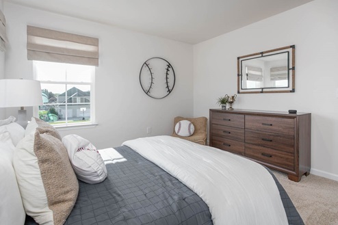 bedroom with carpet and natural light