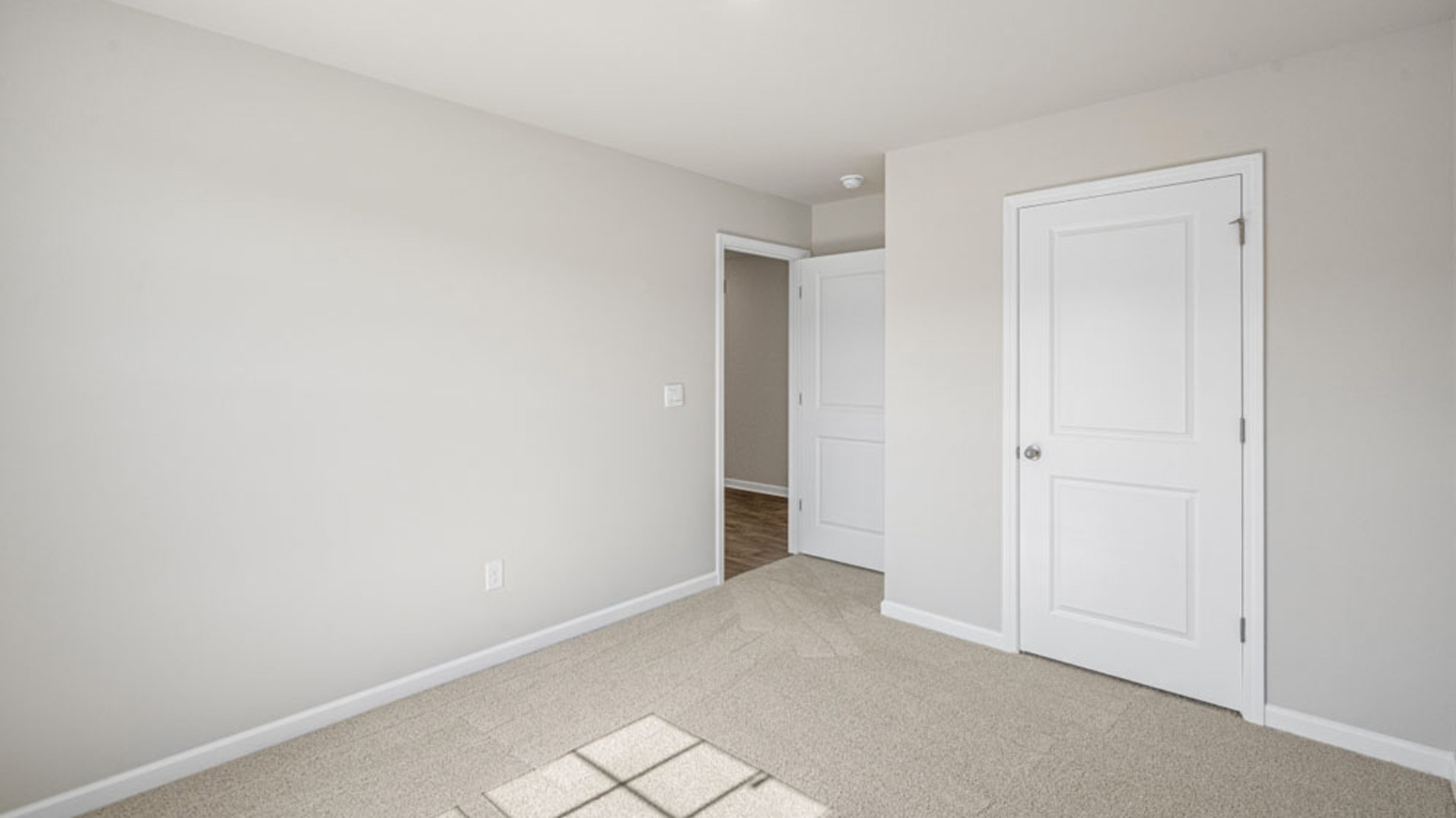bedroom with carpet and natural light