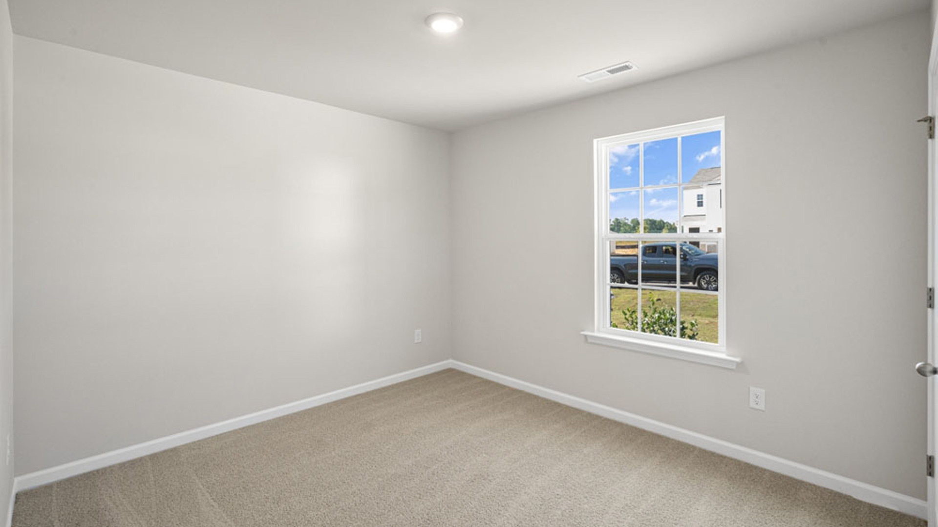 bedroom with carpet and natural light