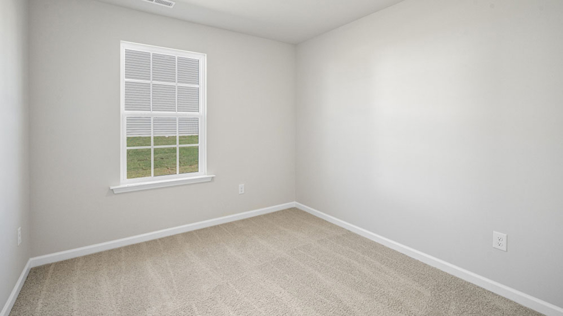 bedroom with carpet and natural light