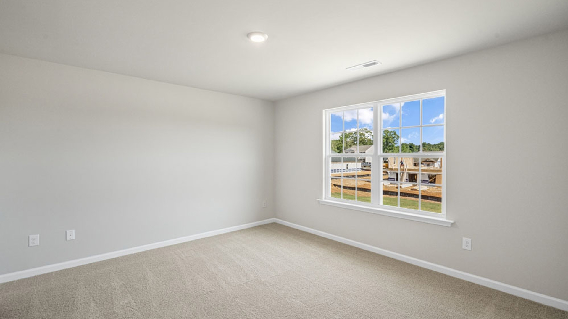 bedroom with carpet and natural light