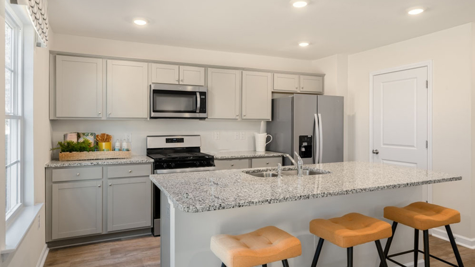 kitchen with vinyl floor and stainless steel appliances