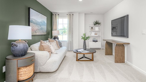 Bedroom with carpet and ample light
