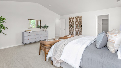 Bedroom with carpet and ample light