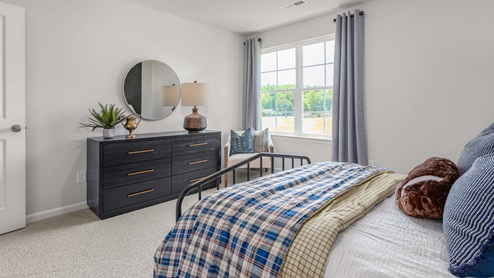 Bedroom with carpet and ample light