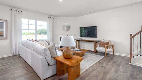 living room with revwood floors and natural light