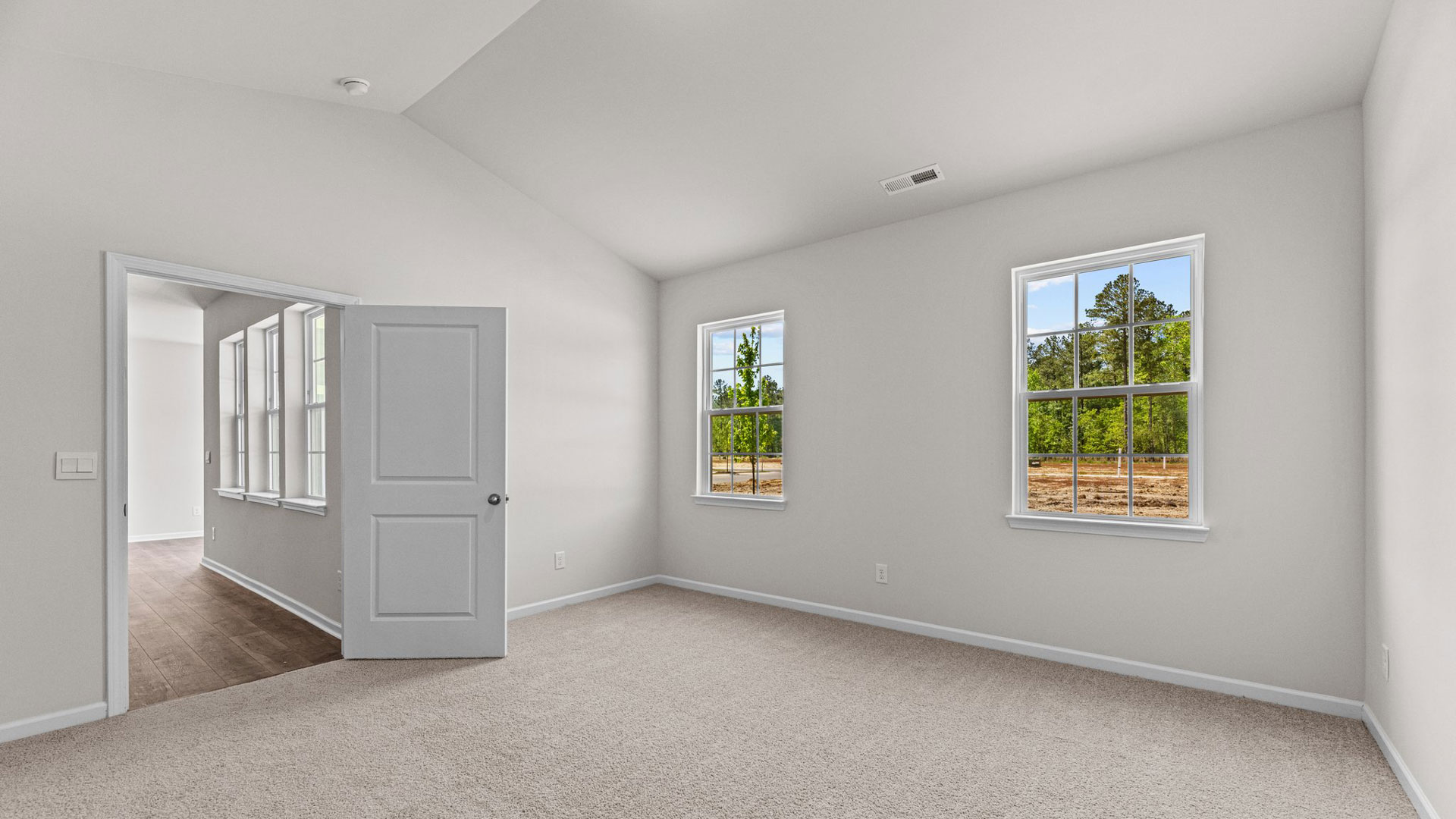 primary bedroom with carpet