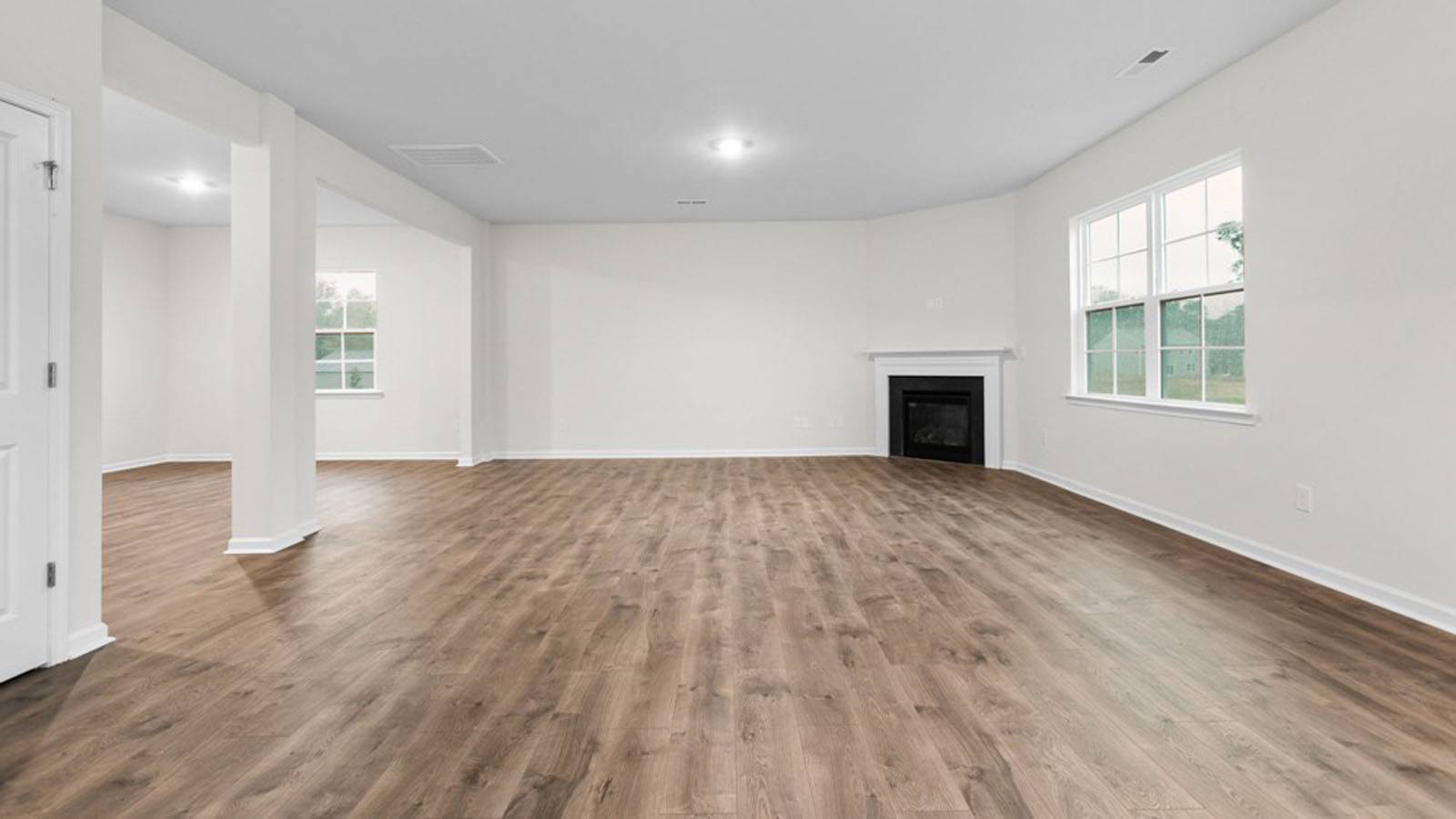 living room with revwood flooring