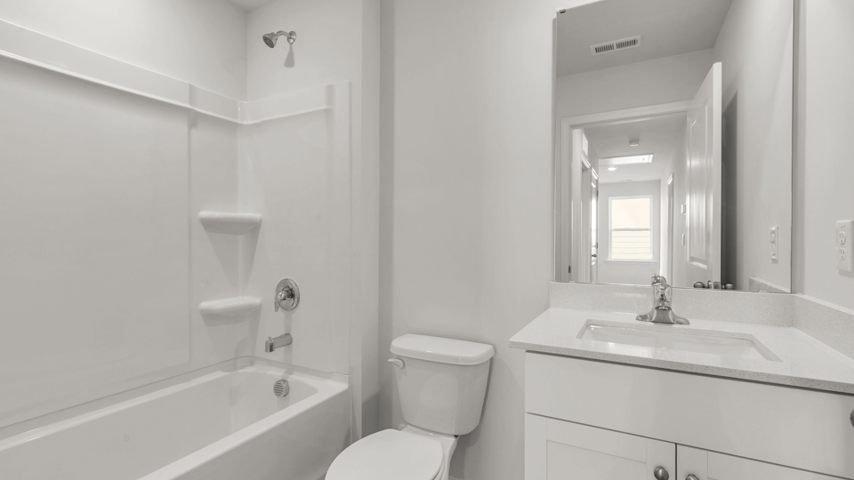 secondary bathroom with tub shower