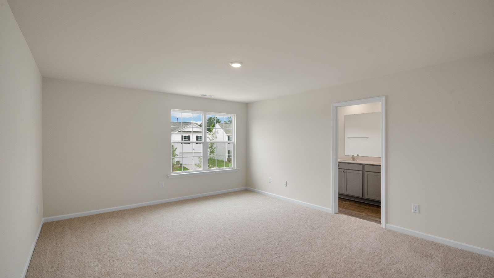primary bedroom with carpet
