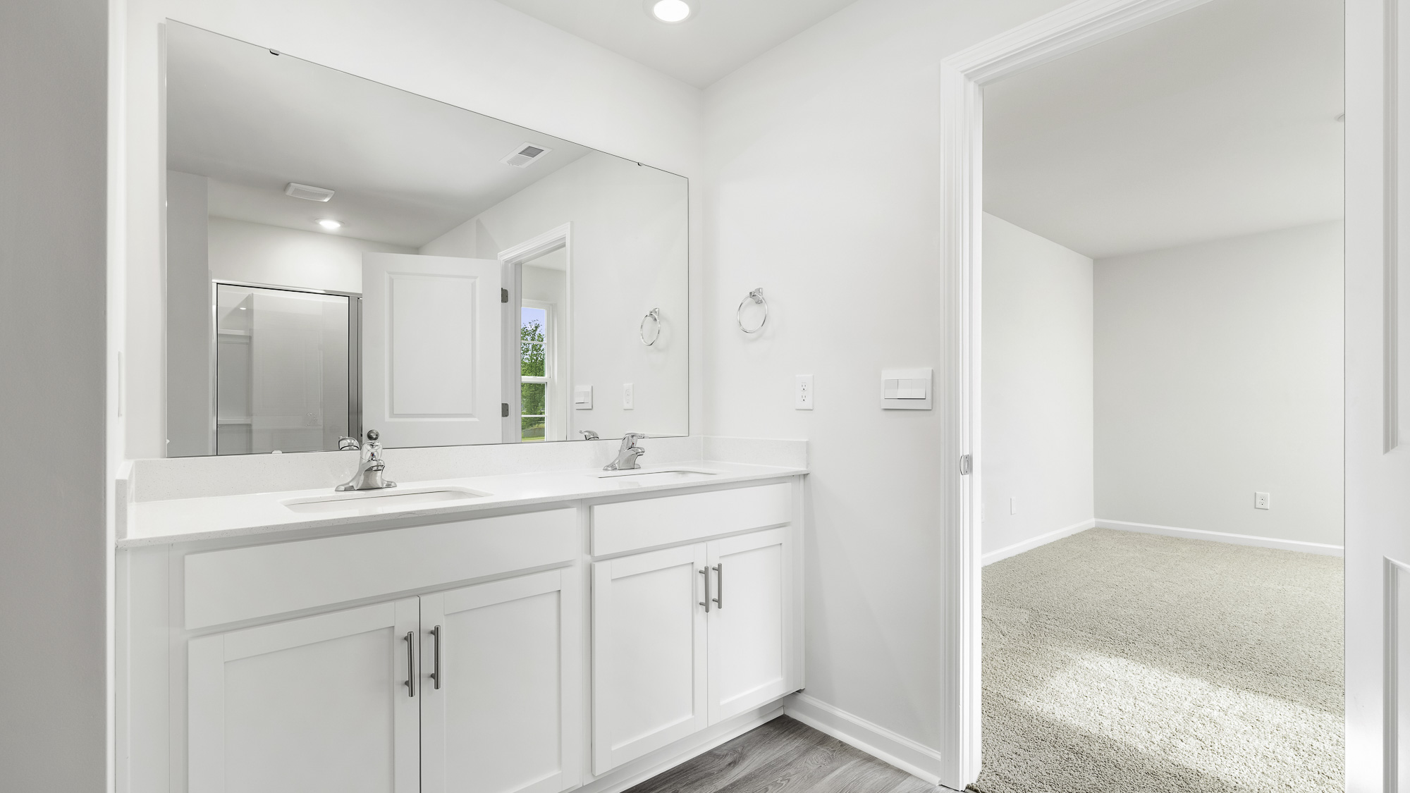 primary bathroom with dual sinks