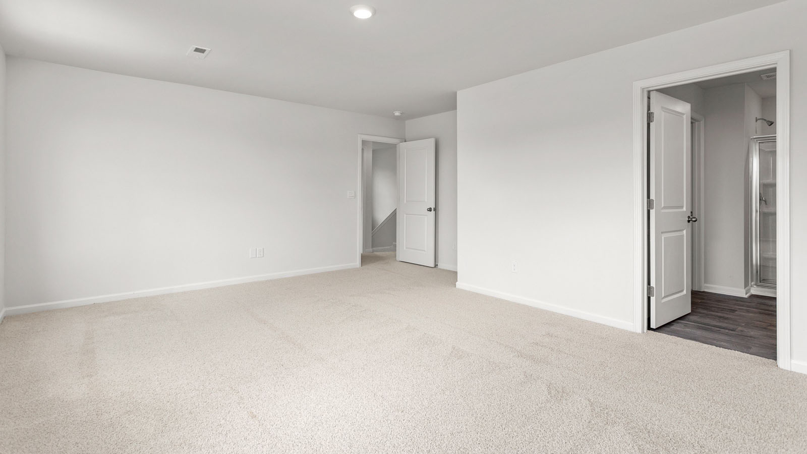 primary bedroom with carpet