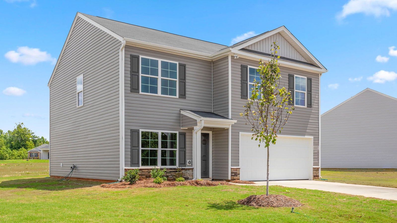 grey vinyl siding on 2 story home