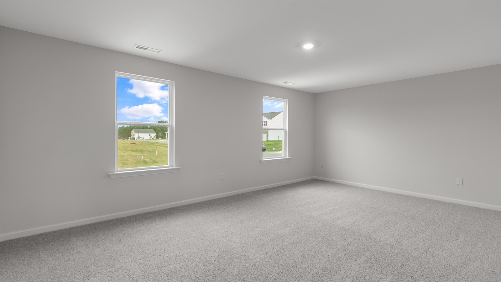 open bedroom with carpet