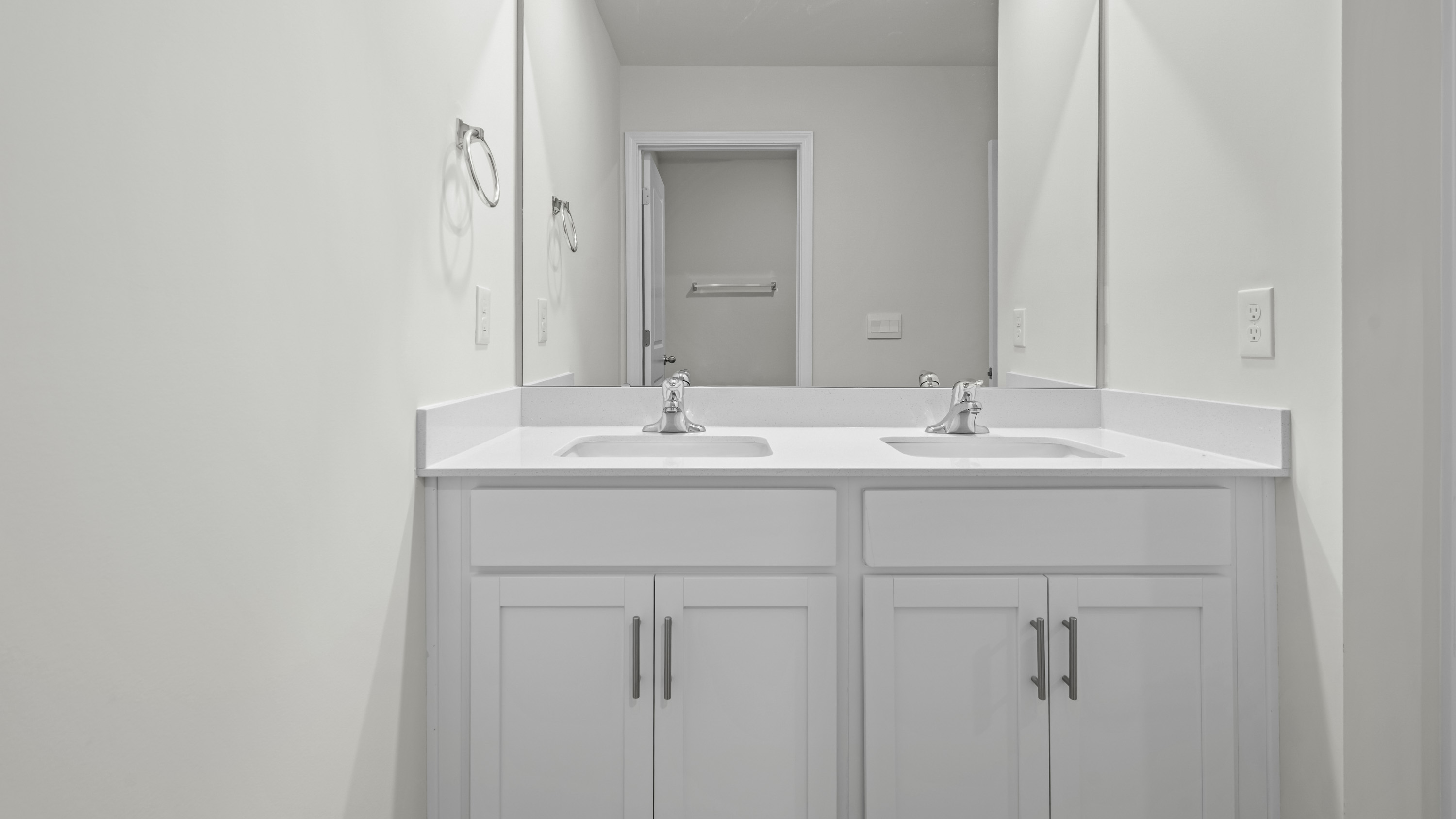 bathroom with dual sinks