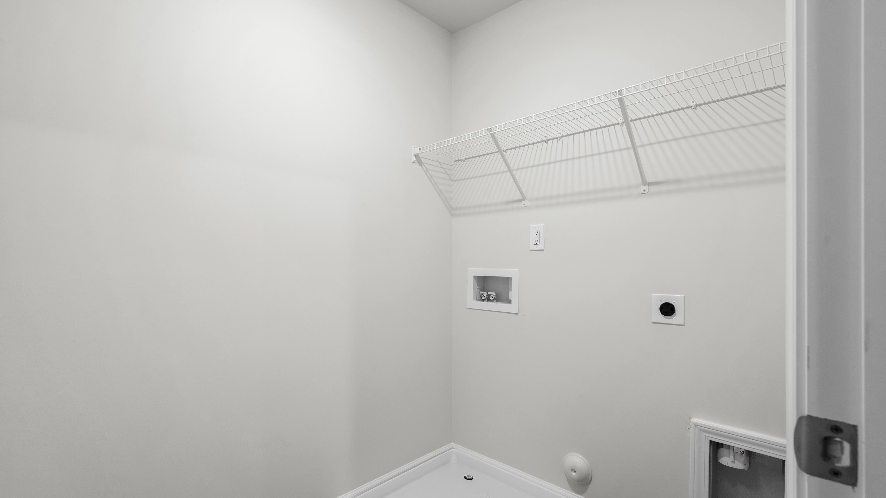 laundry room with wire shelvign