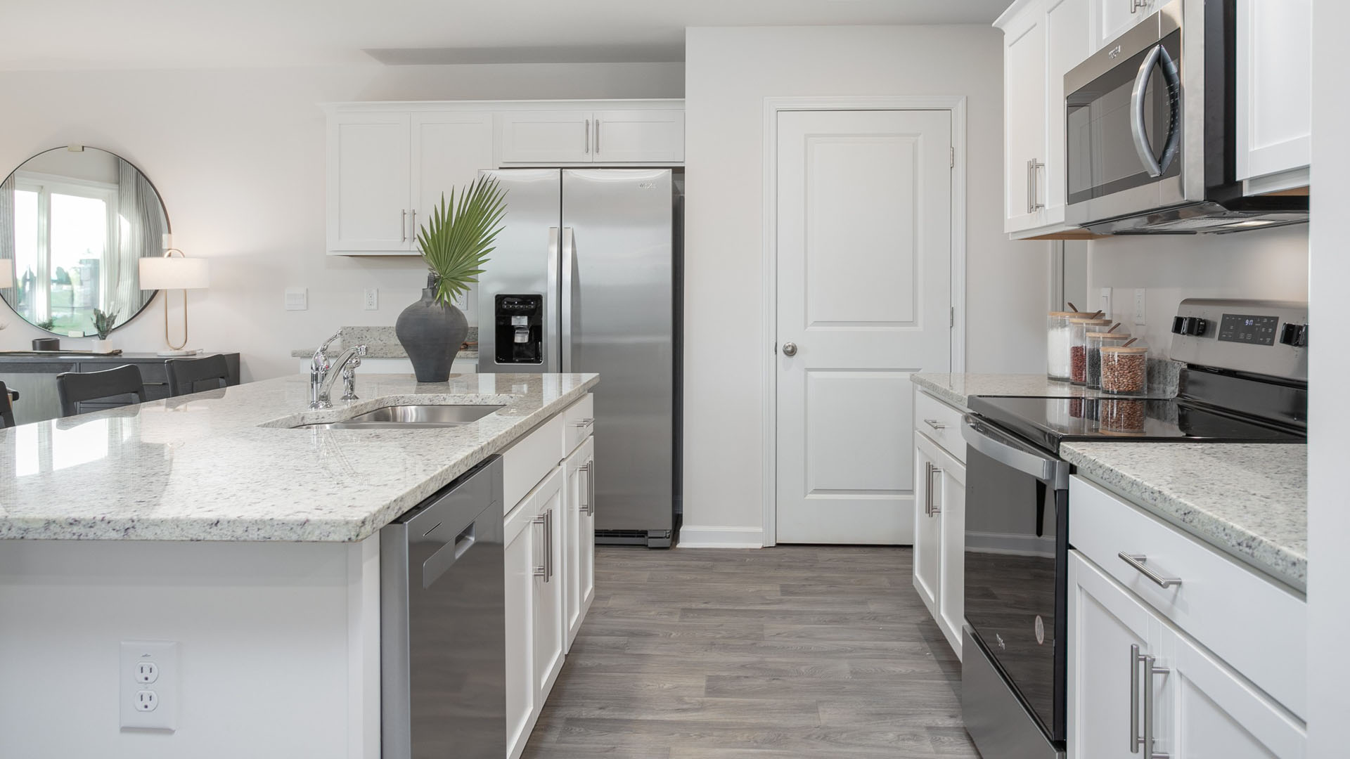 kitchen with island and vinyl floor with stainless steel appliances